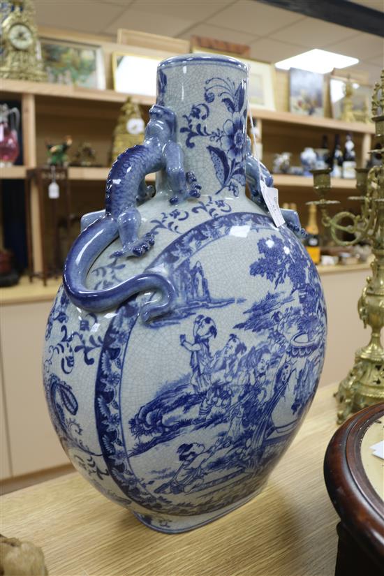 A Chinese blue and white moon flask and a 19th century sleeve vase Tallest piece is 46cm